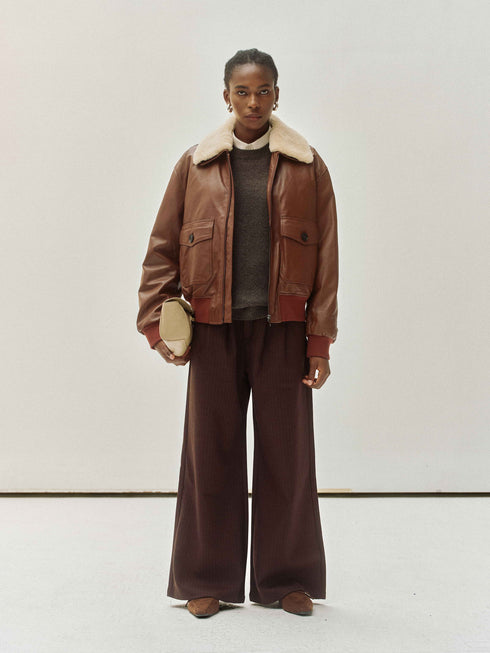 Veste en cuir avec col en peau lainée