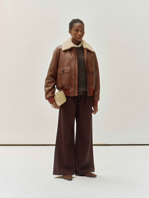 Veste en cuir avec col en peau lainée