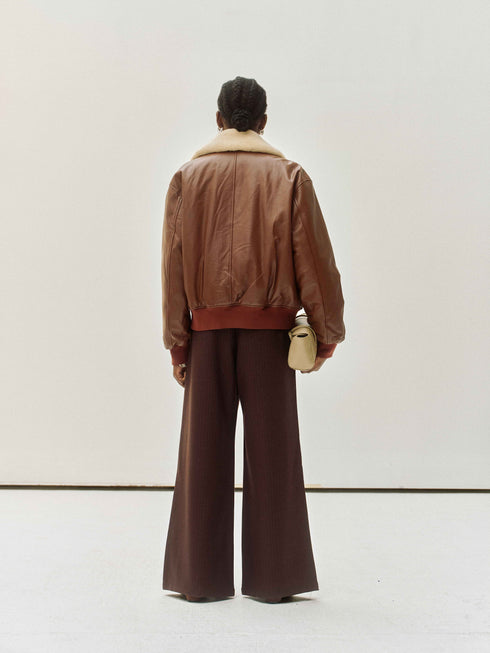 Veste en cuir avec col en peau lainée