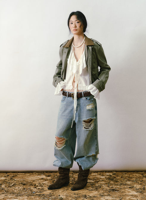 Blusa con fruncido y volantes color marfil