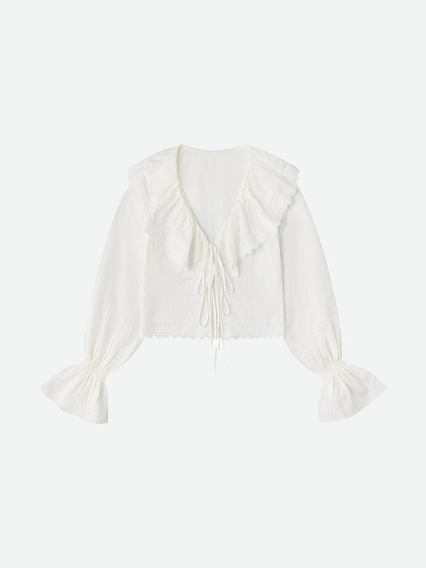 Blusa con fruncido y volantes color marfil