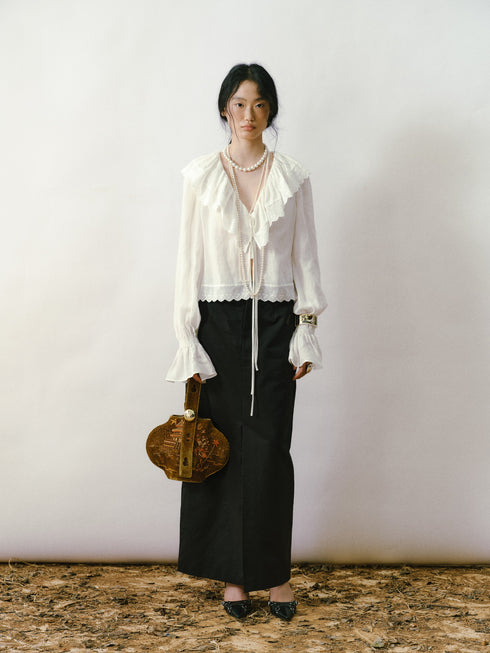 Blusa con fruncido y volantes color marfil