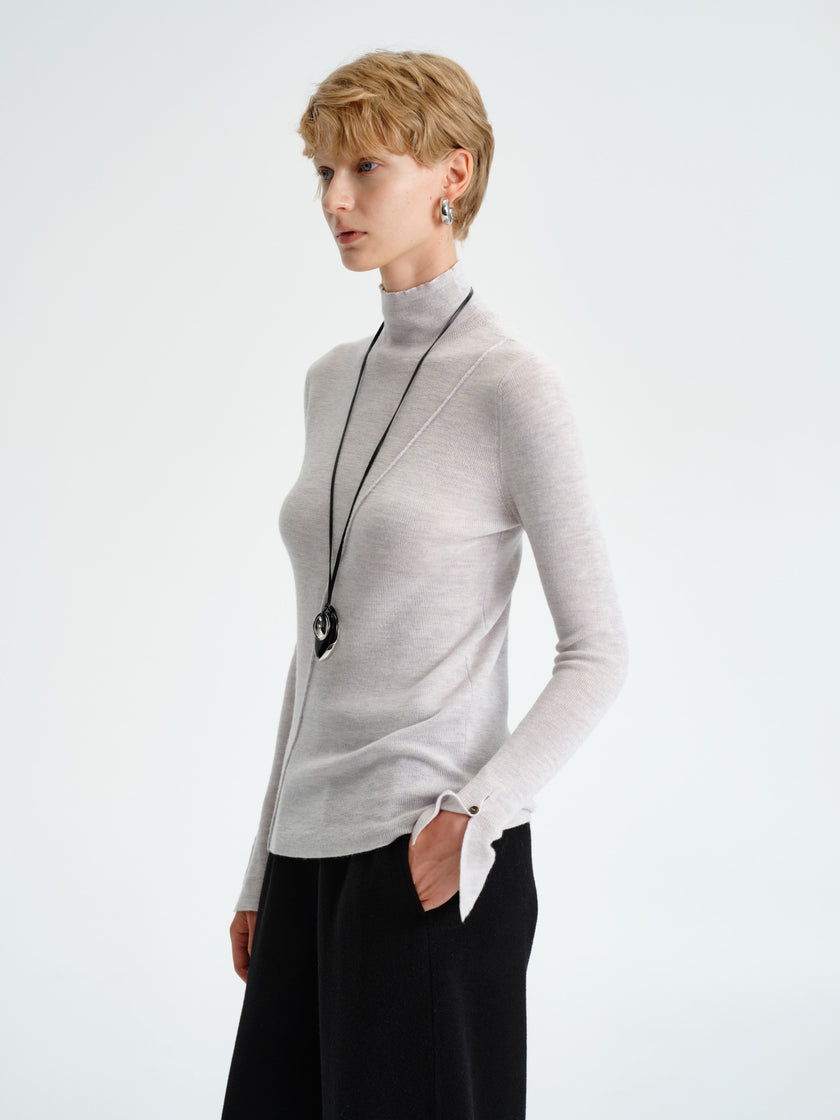 Col roulé asymétrique en laine